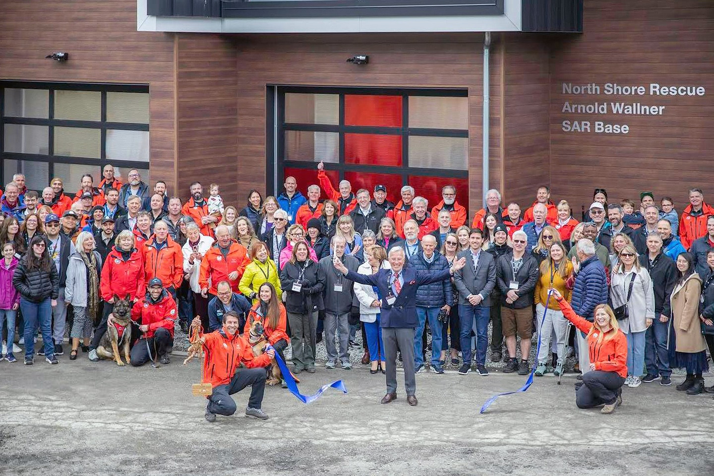 North Shore Rescue Volunteers, their family members and guests – including us –  in attendance at the grand opening of the North Shore Rescue Arnold Wallner SAR Base